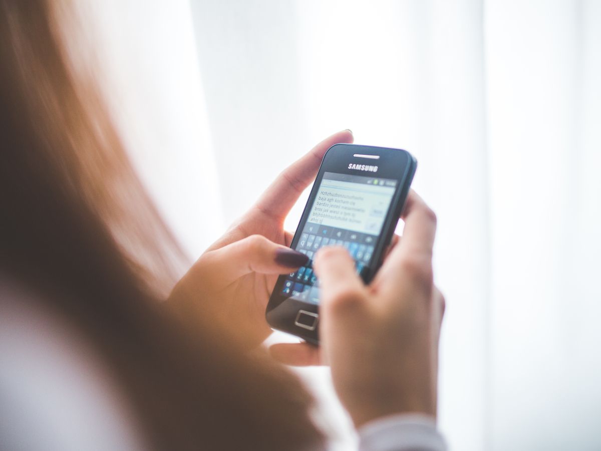 Customer reading a marketing text on her phone