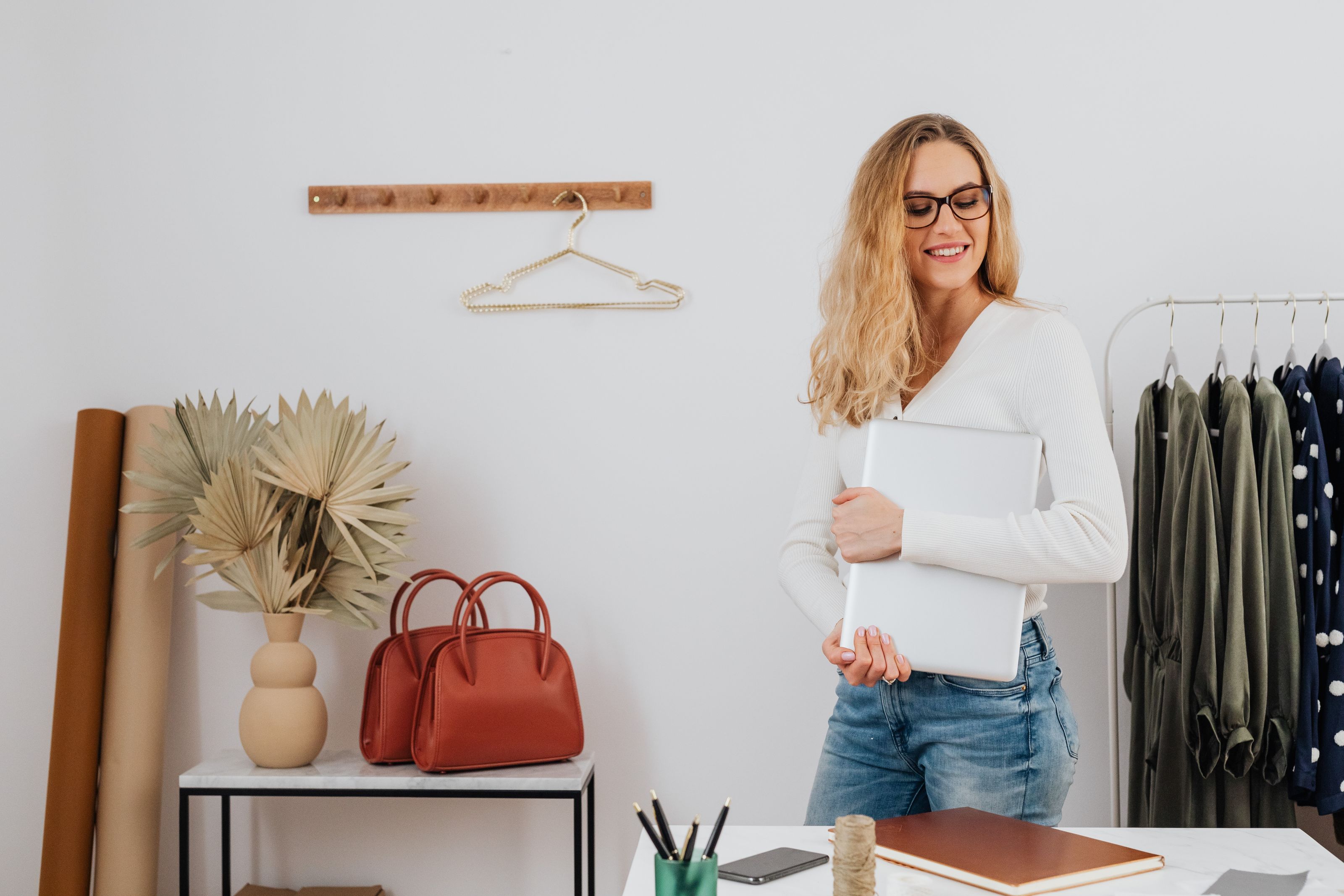 Online store owner getting started with Bozuro on her laptop in her boutique